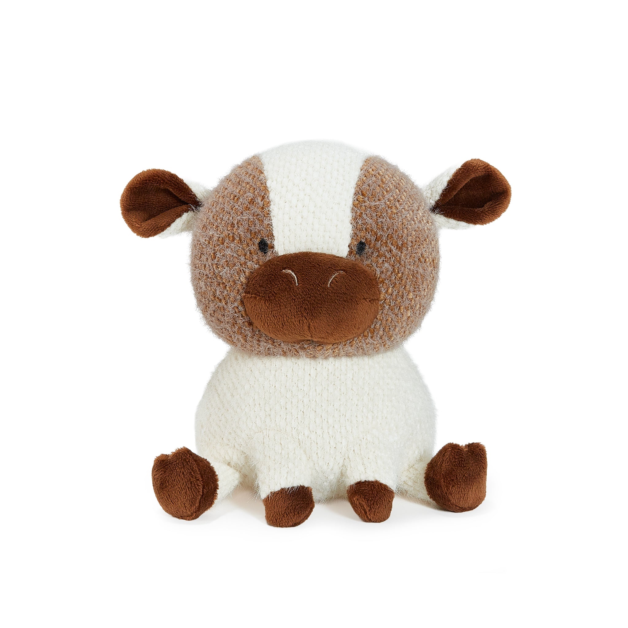 Stuffed animal toy resembling a cow on a white background