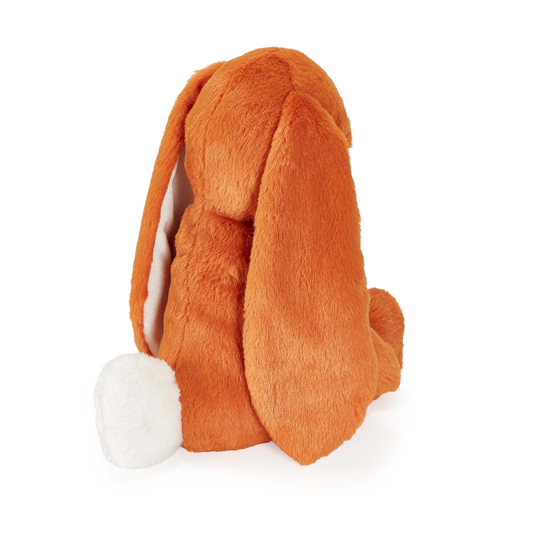 Orange stuffed animal bunny with long ears on white background