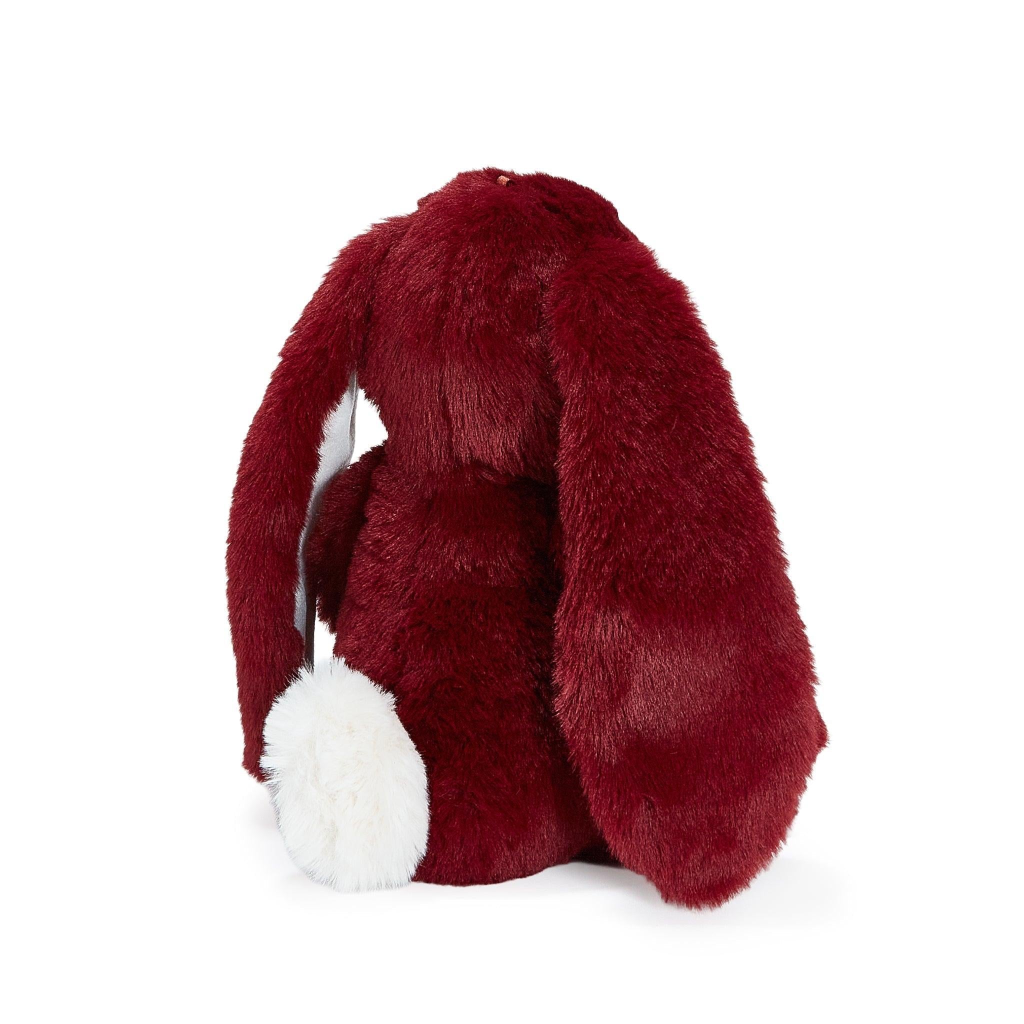 Red plush bunny toy on a white background