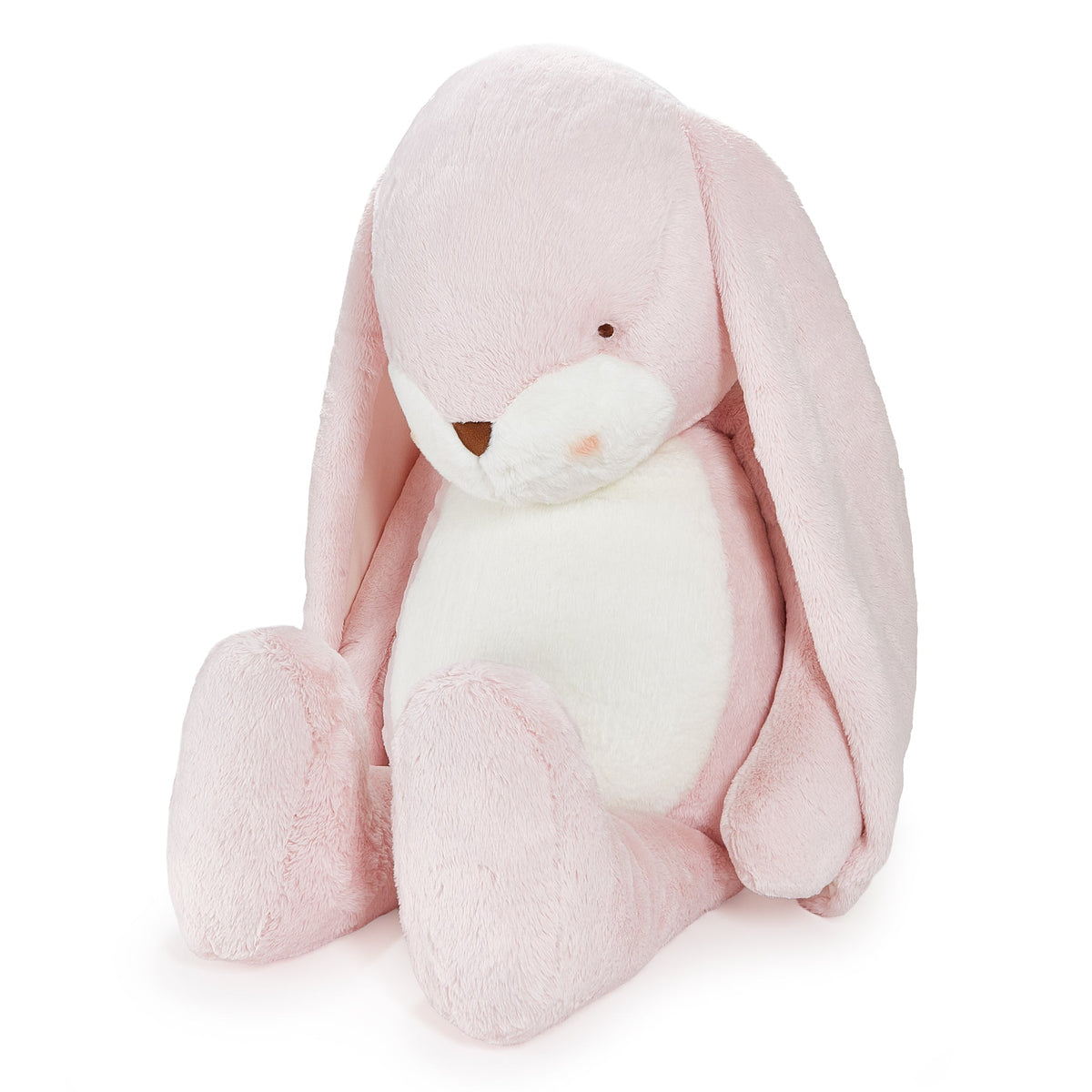 A plush bunny stuffed animal in soft pink and white, sitting upright against a clean white background.