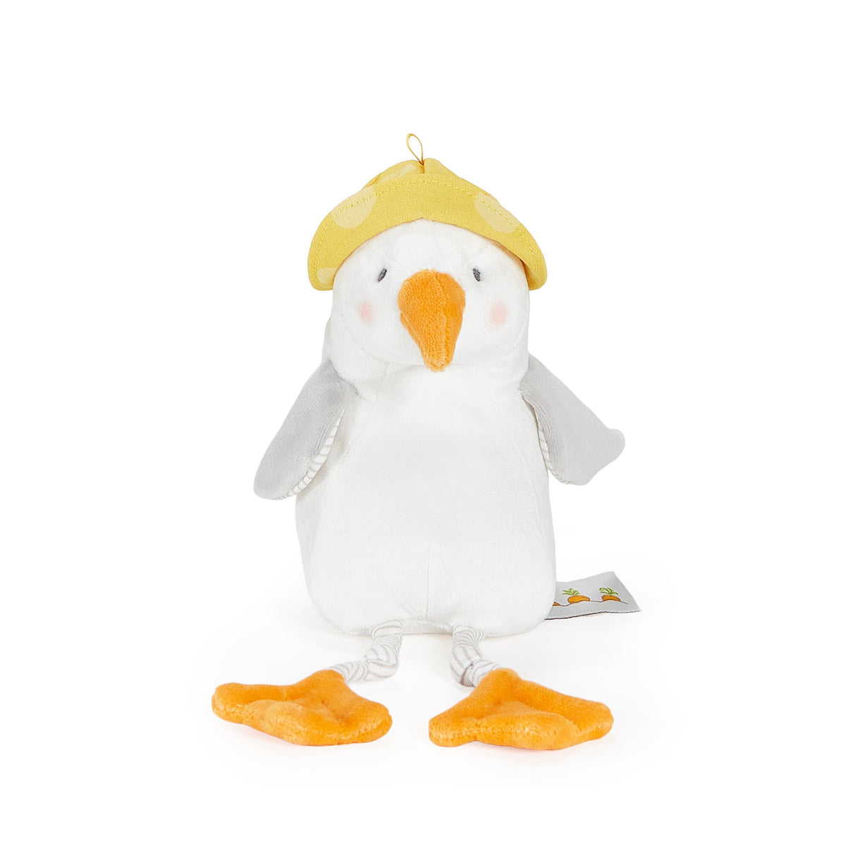 A plush toy seagull wearing a yellow cap, with an orange beak and orange feet, photographed on a clean white background.