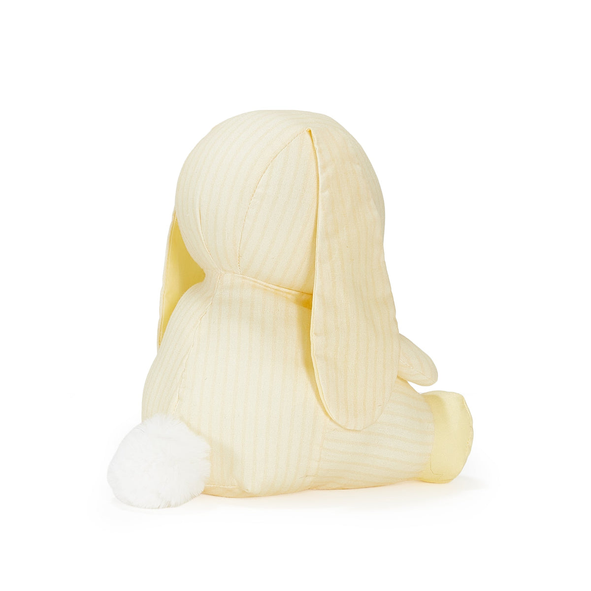 A pale yellow bunny plush toy with subtle vertical stripes, shown from the back on a clean white background.