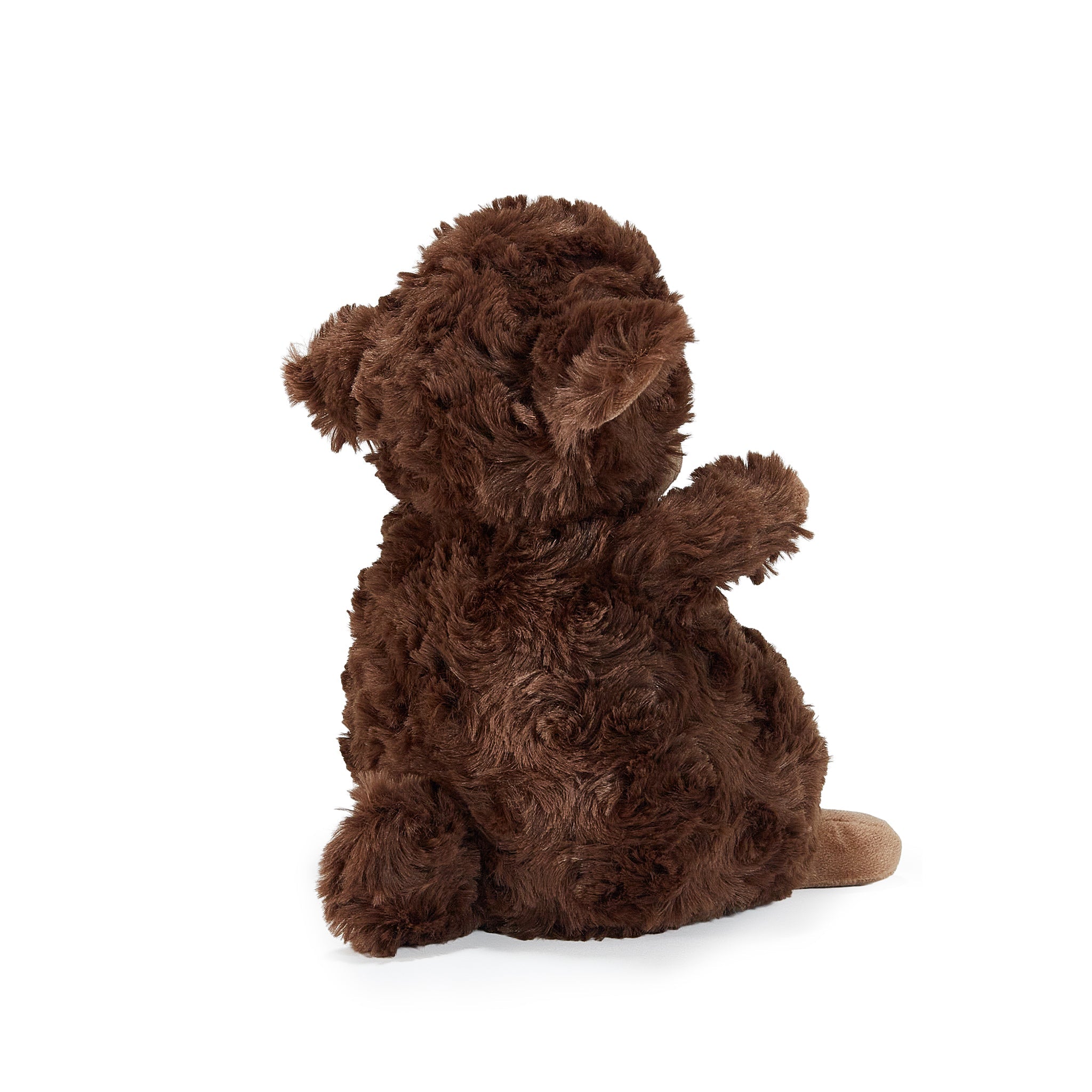 Brown plush lamb sitting on a white background