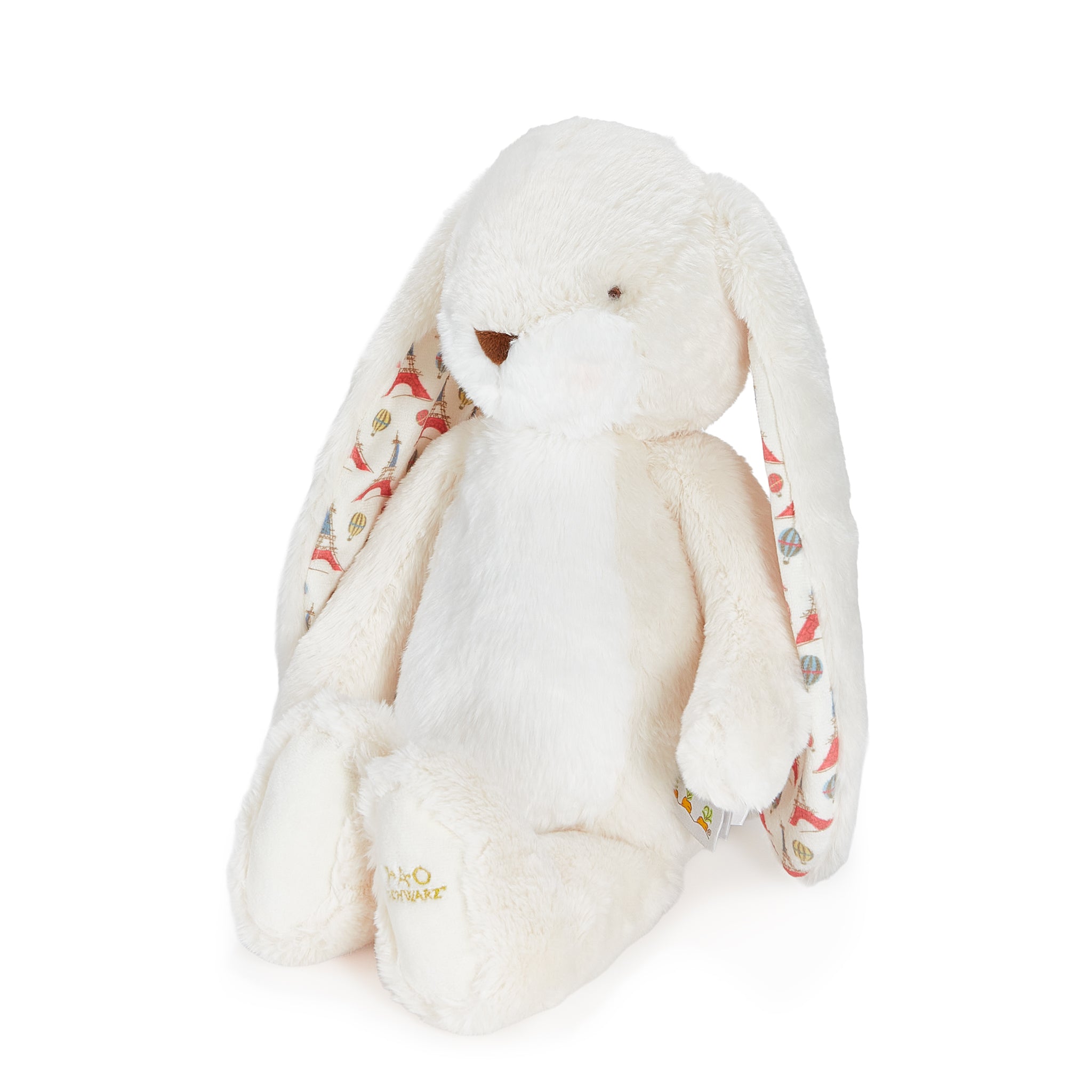 White plush bunny with floral pattern on a white background