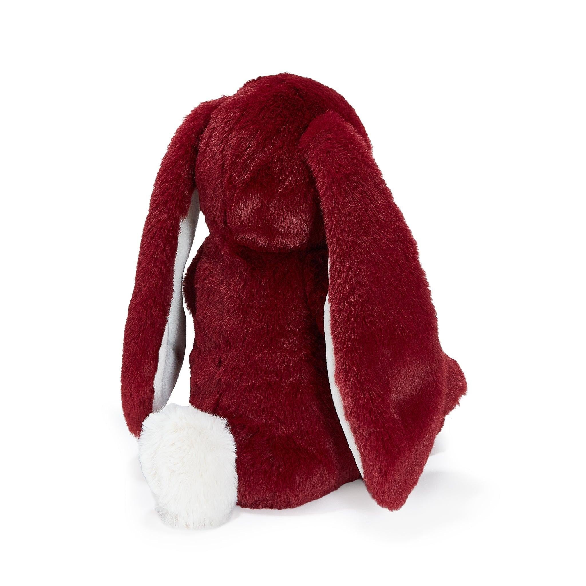 Red plush bunny toy on a white background
