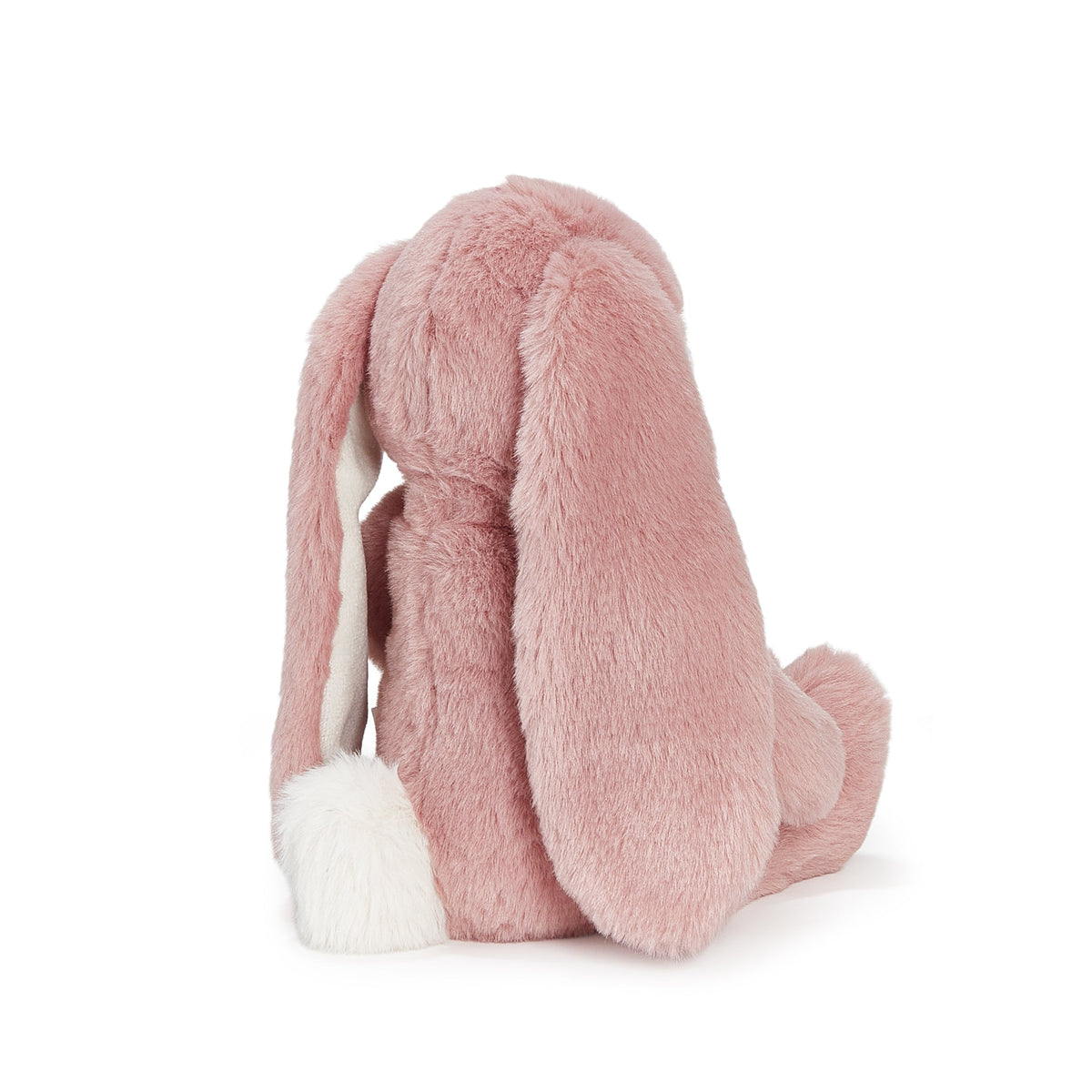 A pink plush bunny backpack shown from the back, featuring long floppy ears with white inner lining and a white fluffy tail, on a solid white background.