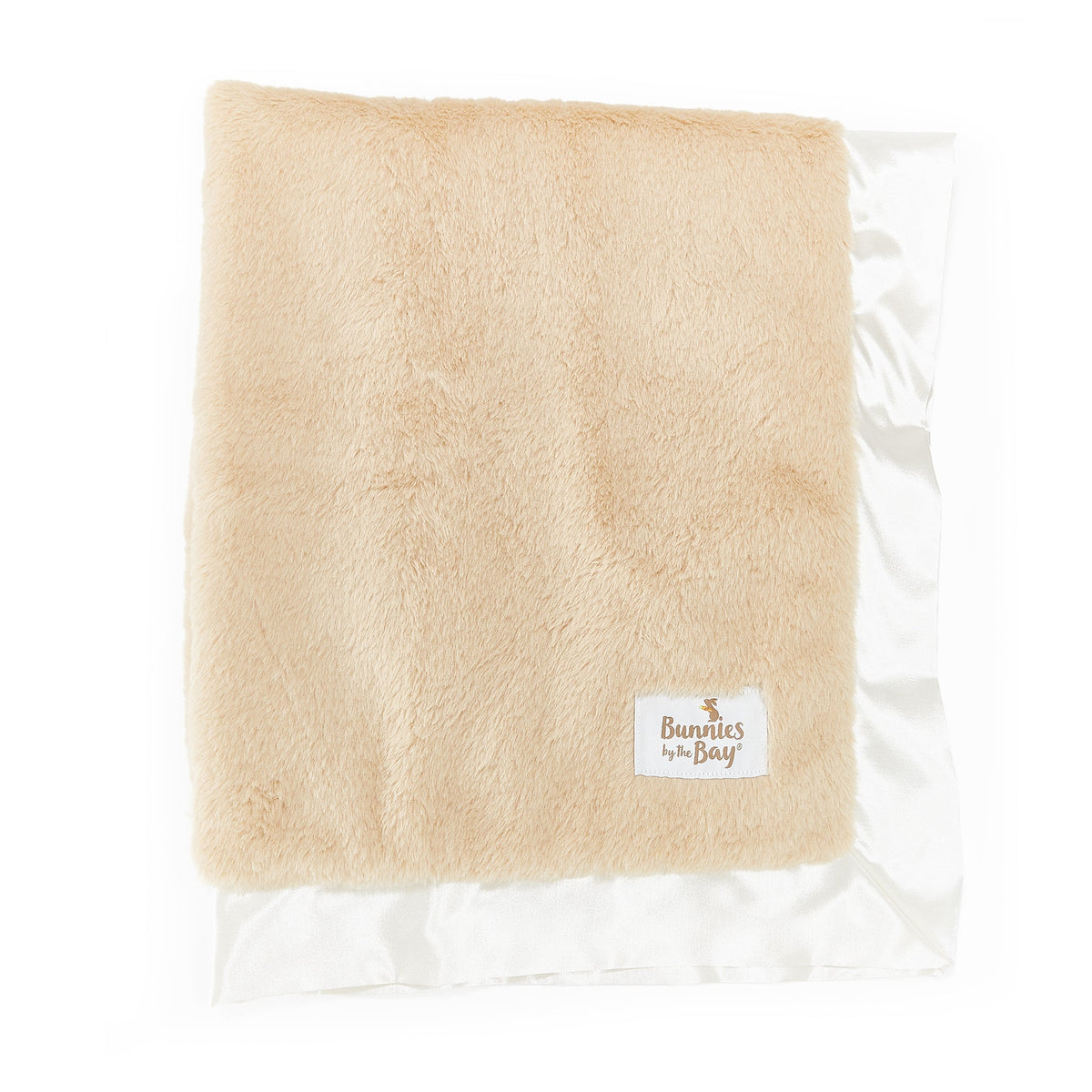 A folded beige faux fur blanket with a white satin border and a small 'Bunnies on Bay' label, shown on a white background.