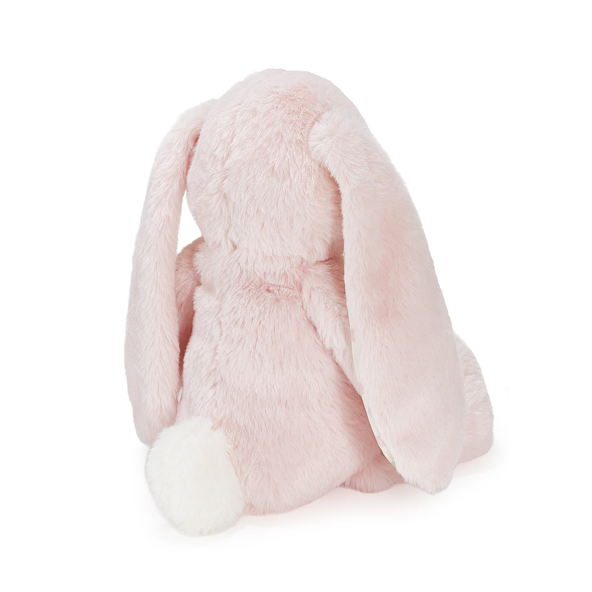 A light pink plush bunny toy shown from the back, featuring long floppy ears and a white fluffy tail, photographed on a clean white background.
